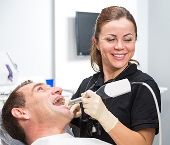 Dentist capturing intraoral images