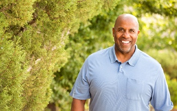 An older man smiling