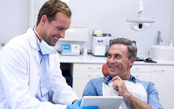 Patient and dental assistant discussing in-house savings plan