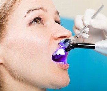 Woman receiving dental bonding treatment