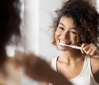 person brushing their teeth