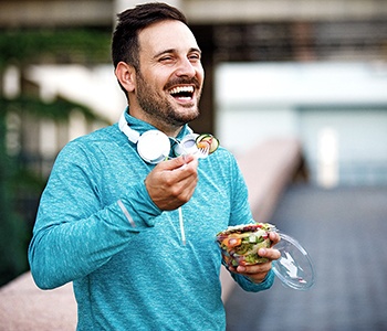 Man eating salad in Carrollton