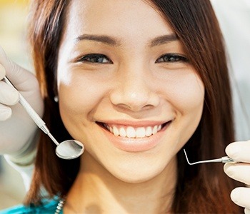 Woman receiving dental checkup