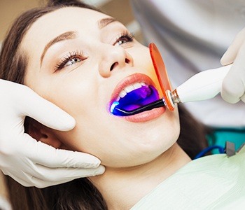 Patient receiving dental sealants