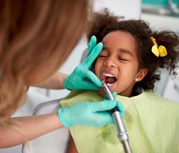 dentist polishing a patient’s teeth