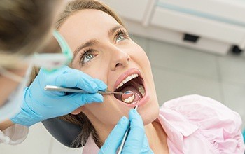 Woman receiving dental exam