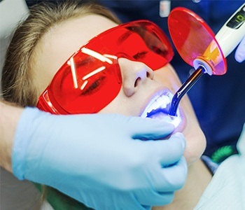 Patient receiving tooth-colored filling