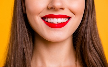 A woman with a white, straight smile