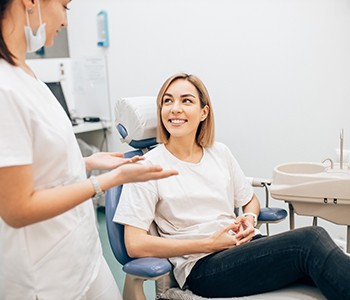 Cosmetic dentist and patient talking during initial consultation