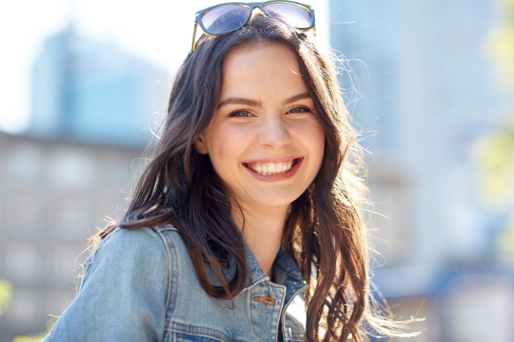 Woman smiling outside