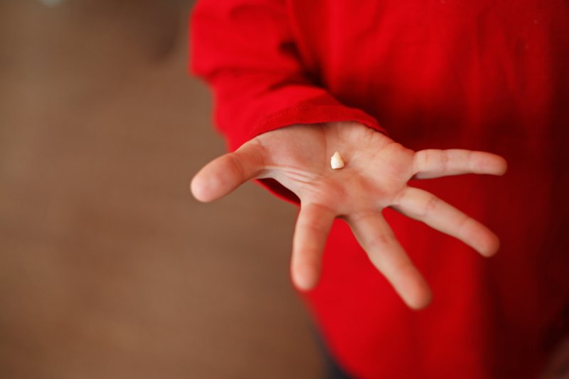 Closeup of tooth in child's hand