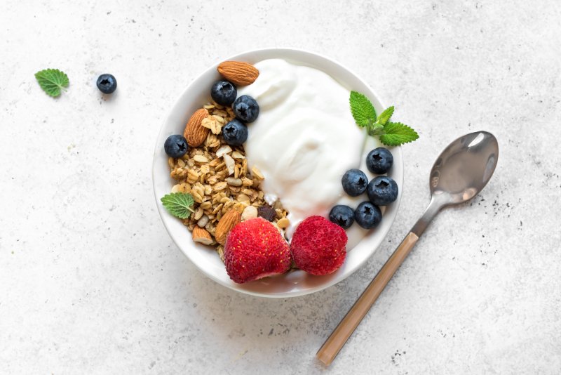 yogurt topped with granolas and berries